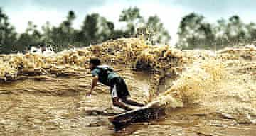 A surfer on the Amazon tidal bore