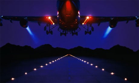 Jet aeroplane taking off at night