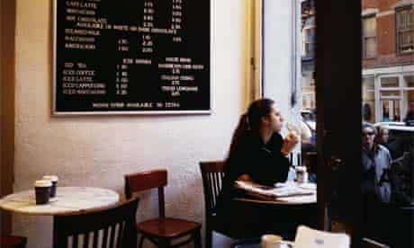 Woman eating alone in a cafe