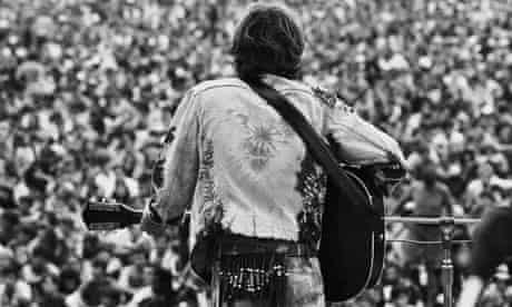 August 15-17, 1969, Near Bethel, New York, USA. John Sebastian, formerly of The Lovin' Spoonful, performs for the masses at the free Woodstock Music and Art Fair. Photograph: Henry Diltz/CORBIS