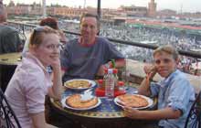 Family eating in Jmaa el Fna square, Marrakech