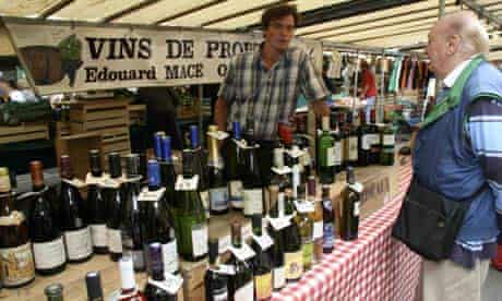 Selling wine at Marché Richard Lenoir in Paris. 
