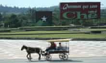 A horse-drawn 'taxi' crosses the parade ground at the Che Guevara memorial in Santa Clara