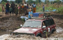 Jeep crossing river, western Tanzania