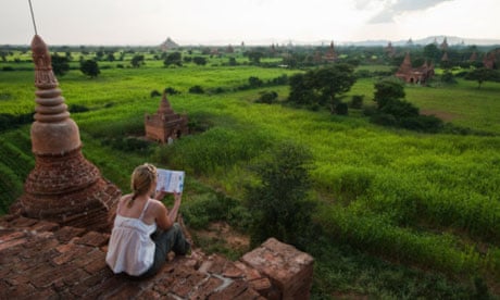 Tourist reading at a Buddhist temple