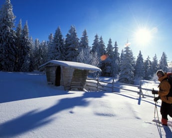 A hiker walking on snow