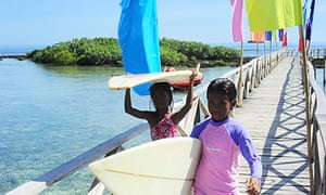 Young surfers at Cloud Nine surf point, Siargao, Philippines
