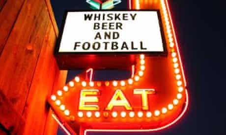 Whiskey, beer and football arrow sign