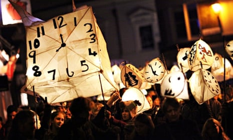 Revellers take part in the annual Burning the Clocks Winter Solstice Parade through Brighton