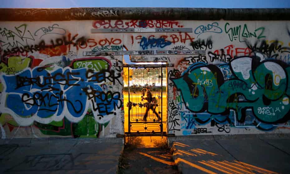 A door at a painted section of the East Side Gallery in Berlin