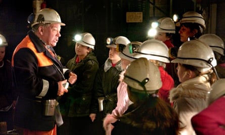 A former miner giving school pupils an underground tour at Big Pit National Coal Museum Blaenavon 