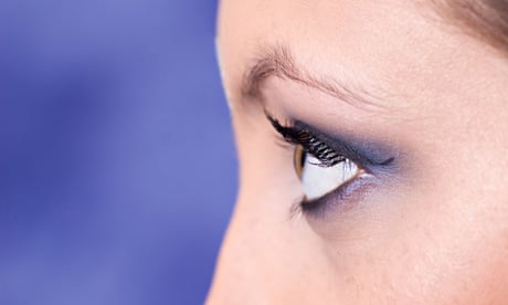 Close up of a young woman looking away wearing blue eyeshadow. Image shot 2008. Exact date unknown.