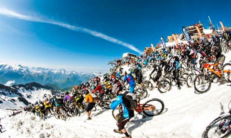 Riders take part in Megavalanche at Pic Blanc, Alpe d'Huez, France