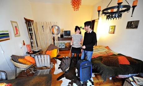 Couple stand in an Airbnb apartment in Berlin