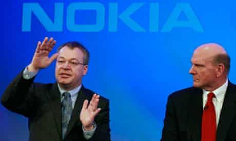 Nokia chief executive Stephen Elop watched by Microsoft chief executive Steve Ballmer