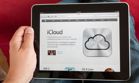 iPad user looks at Apple's iCloud remote-storage service