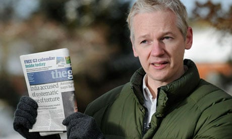WikiLeaks founder Julian Assange holds the Guardian