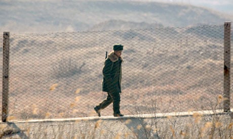 North Korean soldier behind border fence