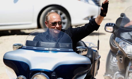 Vladimir Putin waves riding a Harley Davidson near Sevastopol