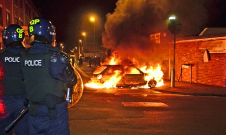 A car burns during riots in St Pauls, Bristol