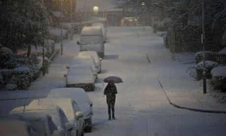 A woman walks through the snow in Bristol 