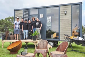 Tiny Homes Carnival guests John Weisbarth, Dave Ng, Jeff Yeo, Adrian Chia, Bryce Langston and Zack Giffin stand in front of one of the houses