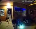Officer uses a facial recognition app to try to identify a detained worker