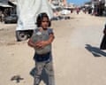 Palestinian children collect water