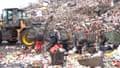 Workers pick through the garbage at the Jakarta landfill