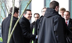 epa04676040 The Greek Premier Alexis Tsipras (2-L) arrives at a hotel in Berlin, Germany, 23 March 2015. Tsipras is scheduled to hold a meeting with German Chancellor Merkel later the day during his visit in Germany. Tsipras is expected to present a list of reforms, hoping to unlock bailout funds to prevent Greece from running out of cash next month, Greek government sources said. EPA/BRITTA PEDERSEN