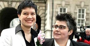 Shannon Sickles (left) and Grainne Close arrive at Belfast city hall as the first set of civil partnership ceremonies for gay couples in the UK takes place in Northern Ireland. Photograph: Paul Faith/PA