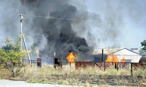 Black smoke billows over fire after shelling in Novoazovsk