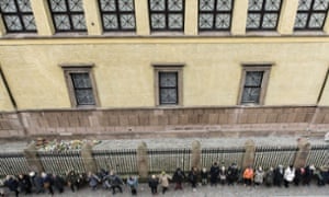 People hold hands in a ring of peace around the Jewish synagogue in Copenhagen to symbolise unity in the fight against terrorism.