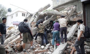 People search for survivors in the rubble of a destroyed building after an earthquake hit Nepal.