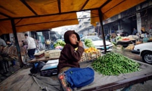 A Palestinian boy waits for customers at a market in Gaza City