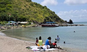 Tourists on the beach at Frigate Bay South, St Kitts.