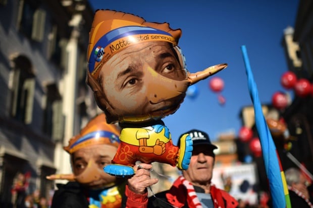 Balloons featuring Italian Prime minister Matteo Renzi as Pinocchio are displayed during a general strike called by several trade union organisations to protest against the government's economic policy, on december 12, 2014 in Rome.