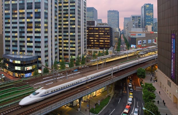 A Marunouchi Shinkansen bullet train passes through central Tokyo.