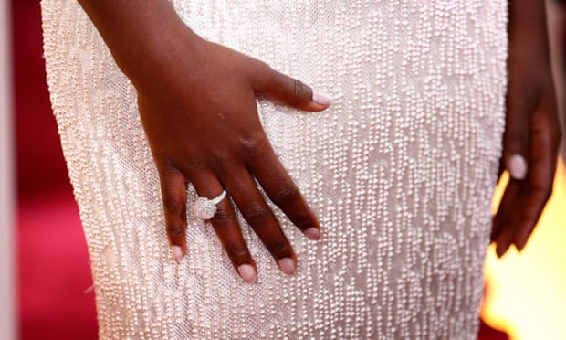 Close-up of the Calvin Klein gown and Chopard diamonds worn by Lupita Nyong'o at the Oscars.