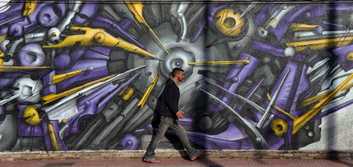 See no evil? While some are bright and jaunty, many of the street artworks in the Greek capital allude to deeper worries